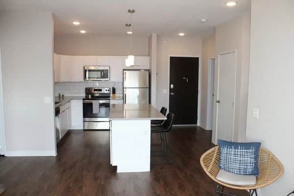 Stylish Campustown Stay with Gym & Balcony